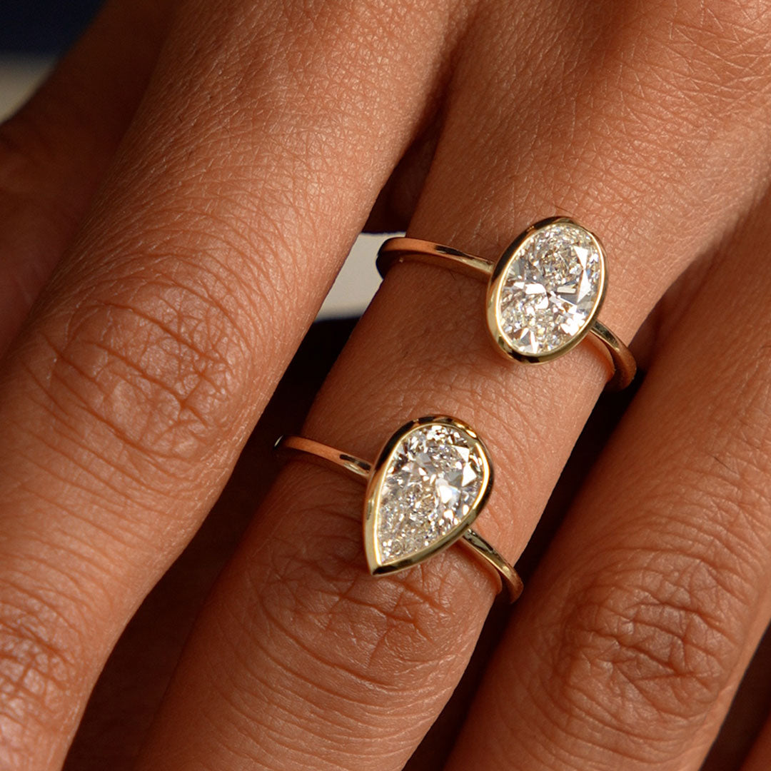 Oval Cut Lab Grown Diamond Bezel Setting Engagement Ring