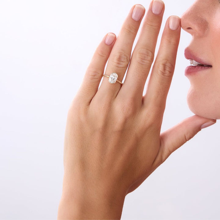 Oval Shaped Diamond Half Bezel Set Engagement Ring