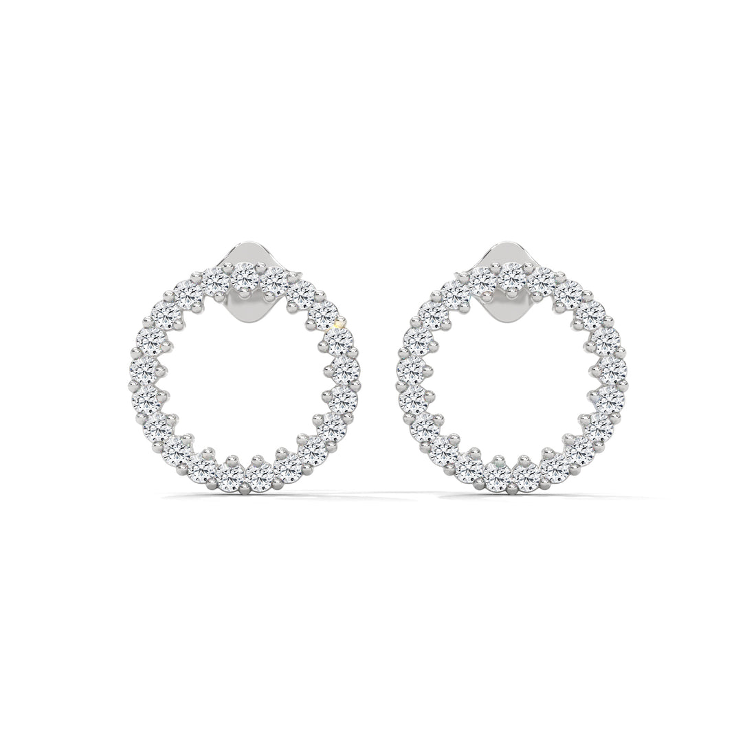 Pair of silver hoop earrings with clear gemstones on a white background