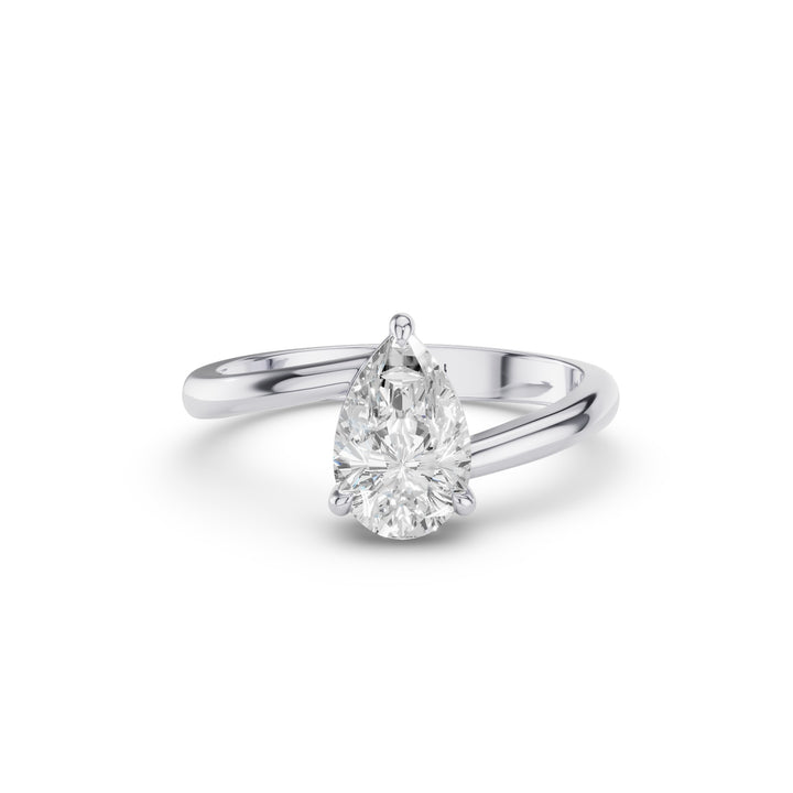 A pear-cut diamond engagement ring in a polished silver-colored metal band, shown on a clean white background.