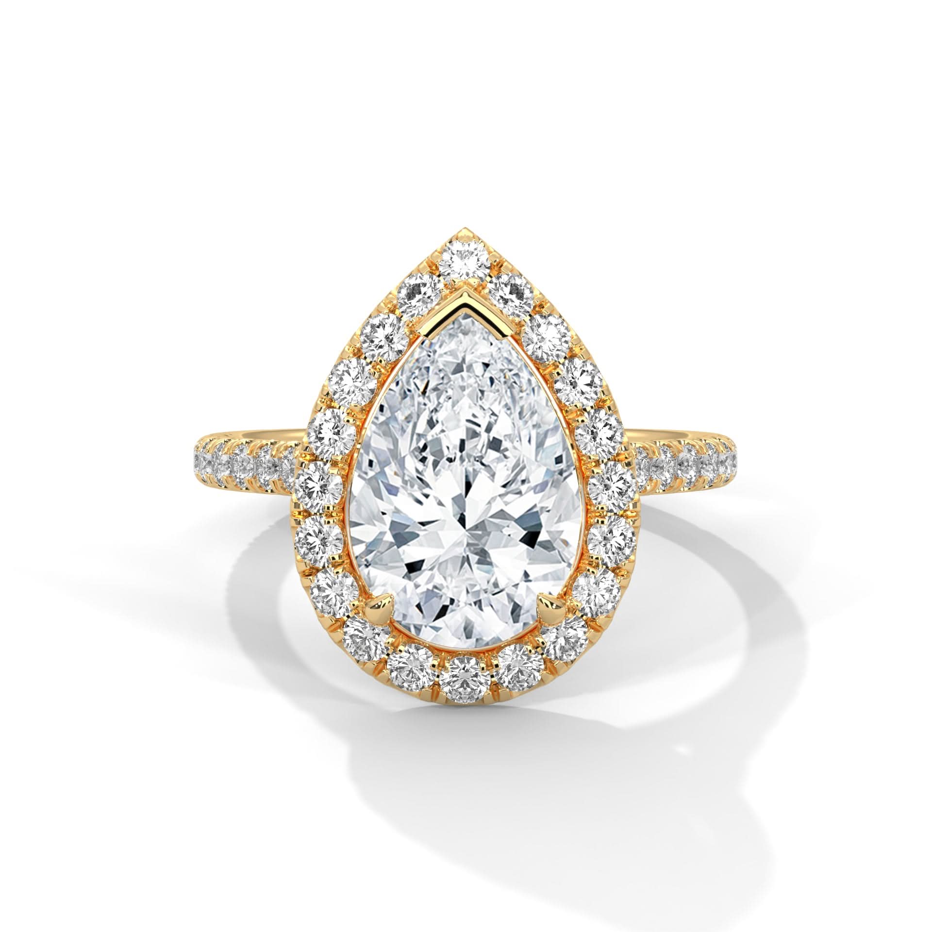 Gold and diamond ring with a pear-shaped center stone on a white background