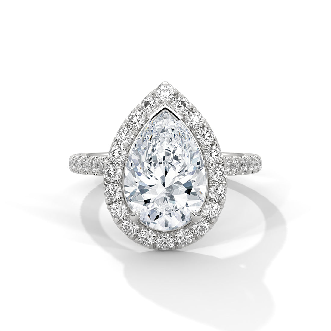 Diamond ring with pear-shaped center stone on a white background