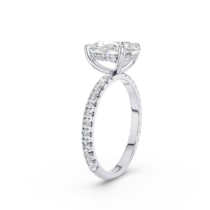A silver-tone diamond engagement ring featuring a marquise-cut center stone in a prong setting, with a pavé band of round diamonds, shown on a clean white background.