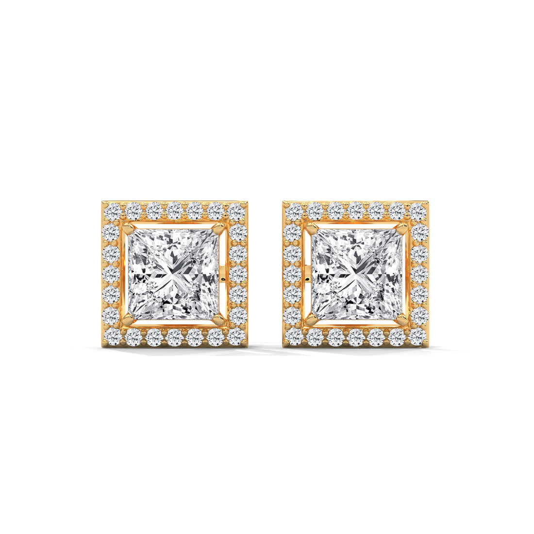Pair of diamond earrings with gold frames on a white background