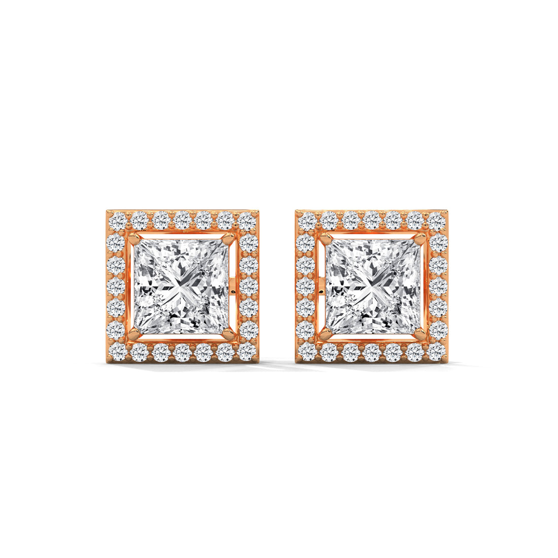 Pair of diamond earrings with rose gold setting on a white background