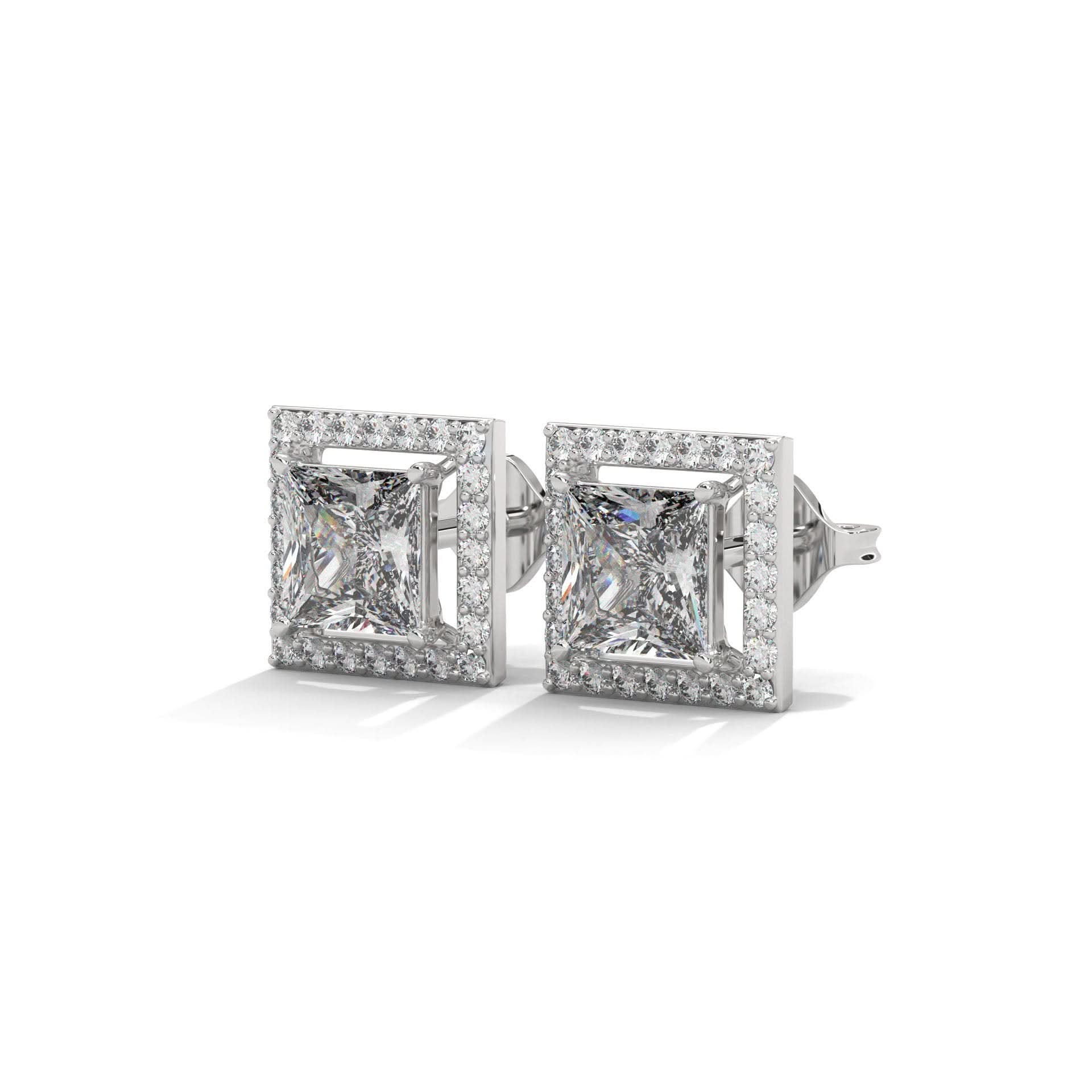 Pair of diamond stud earrings on a white background