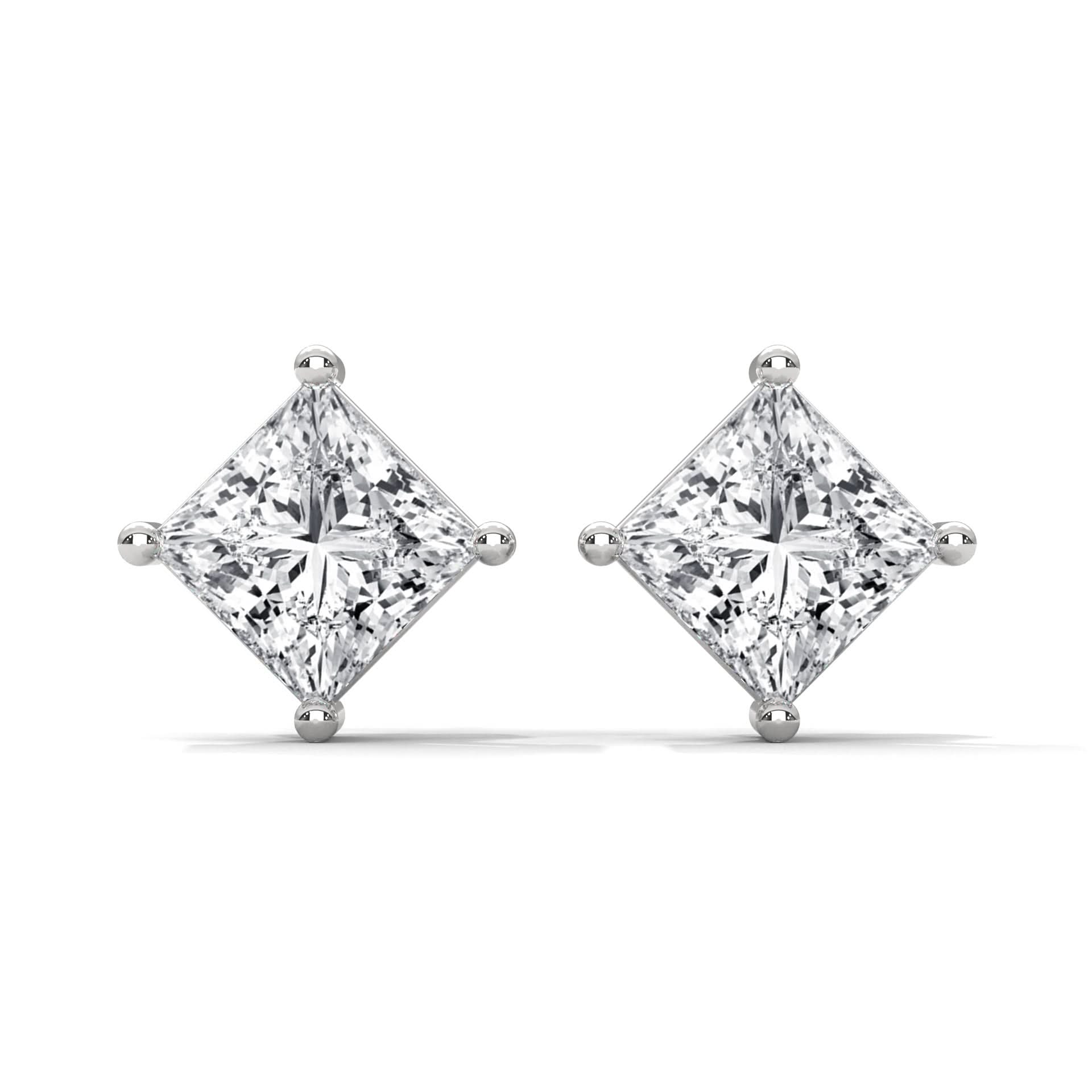 Pair of diamond earrings on a white background