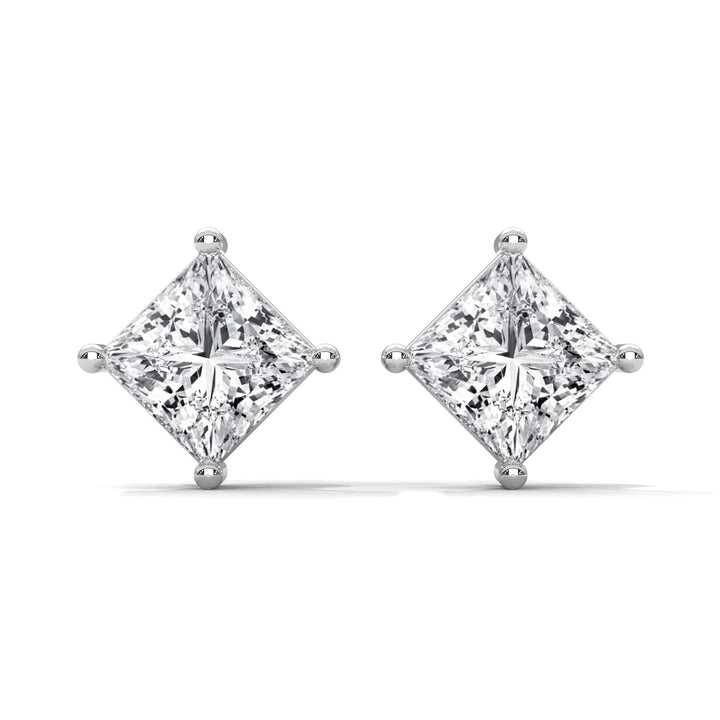 Pair of diamond earrings on a white background