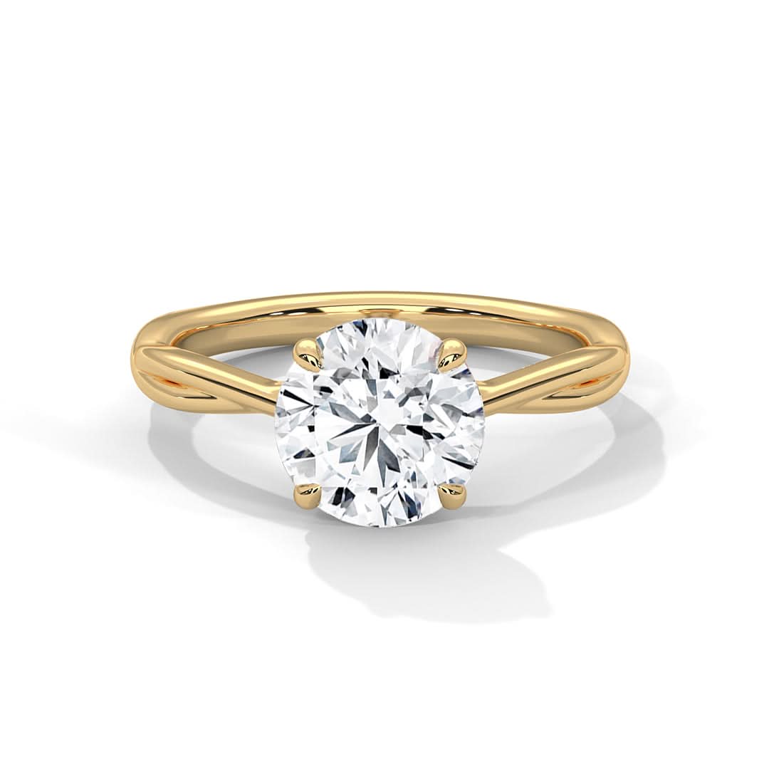 Gold ring with a diamond on a white background