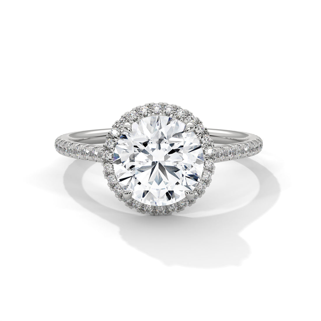 Diamond ring with a halo on a white background