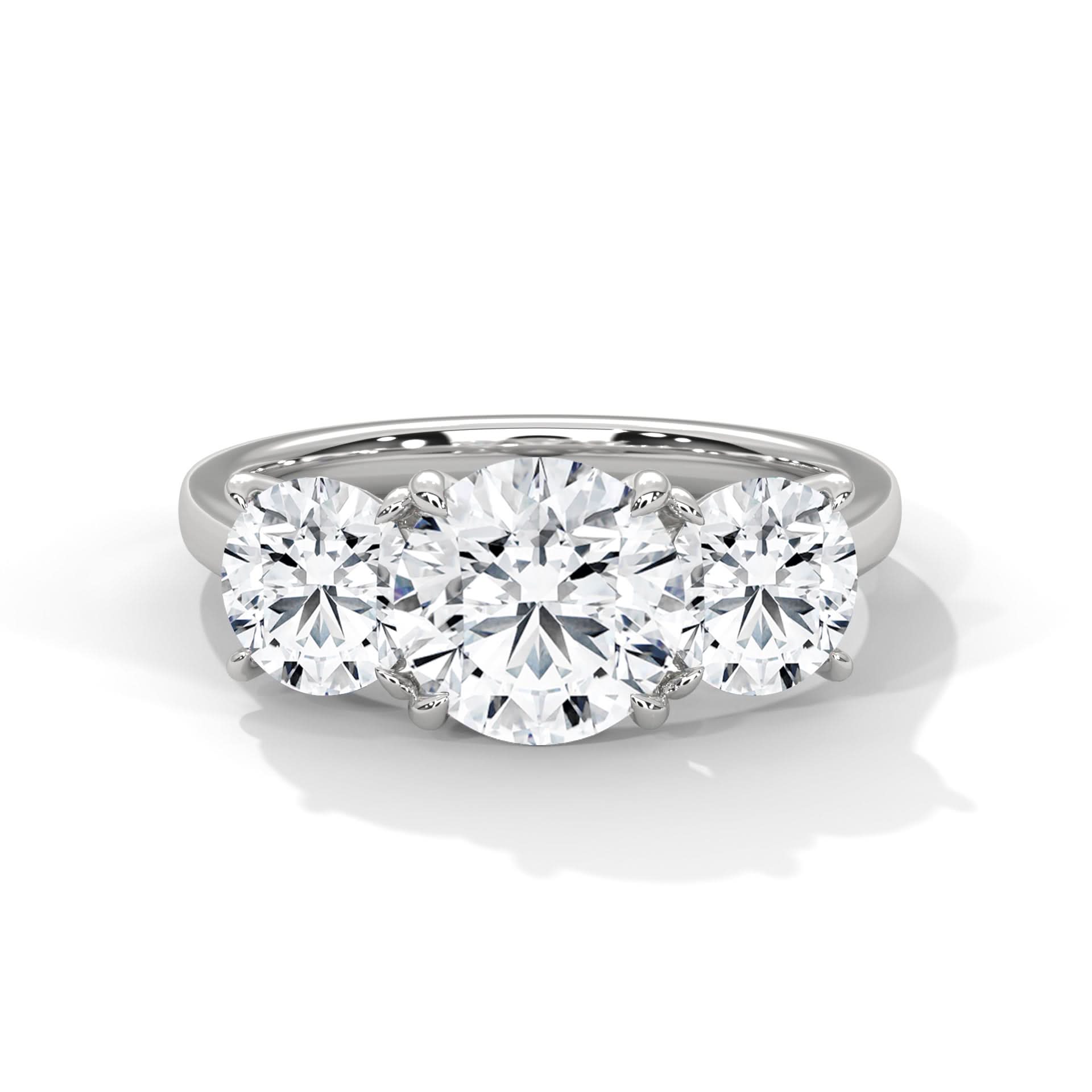 Diamond ring with three round diamonds on a white background
