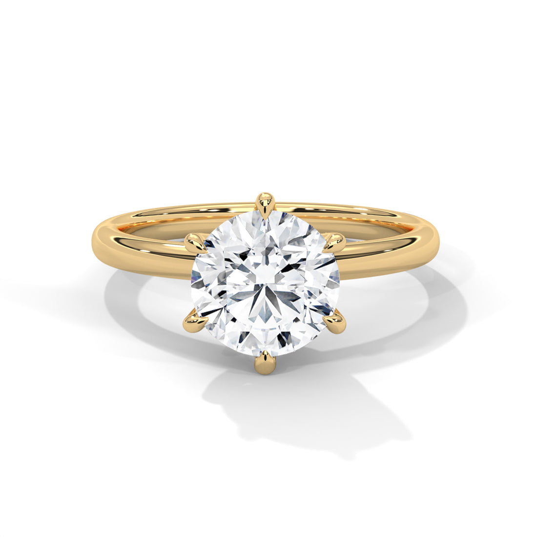 Gold ring with a large diamond on a white background