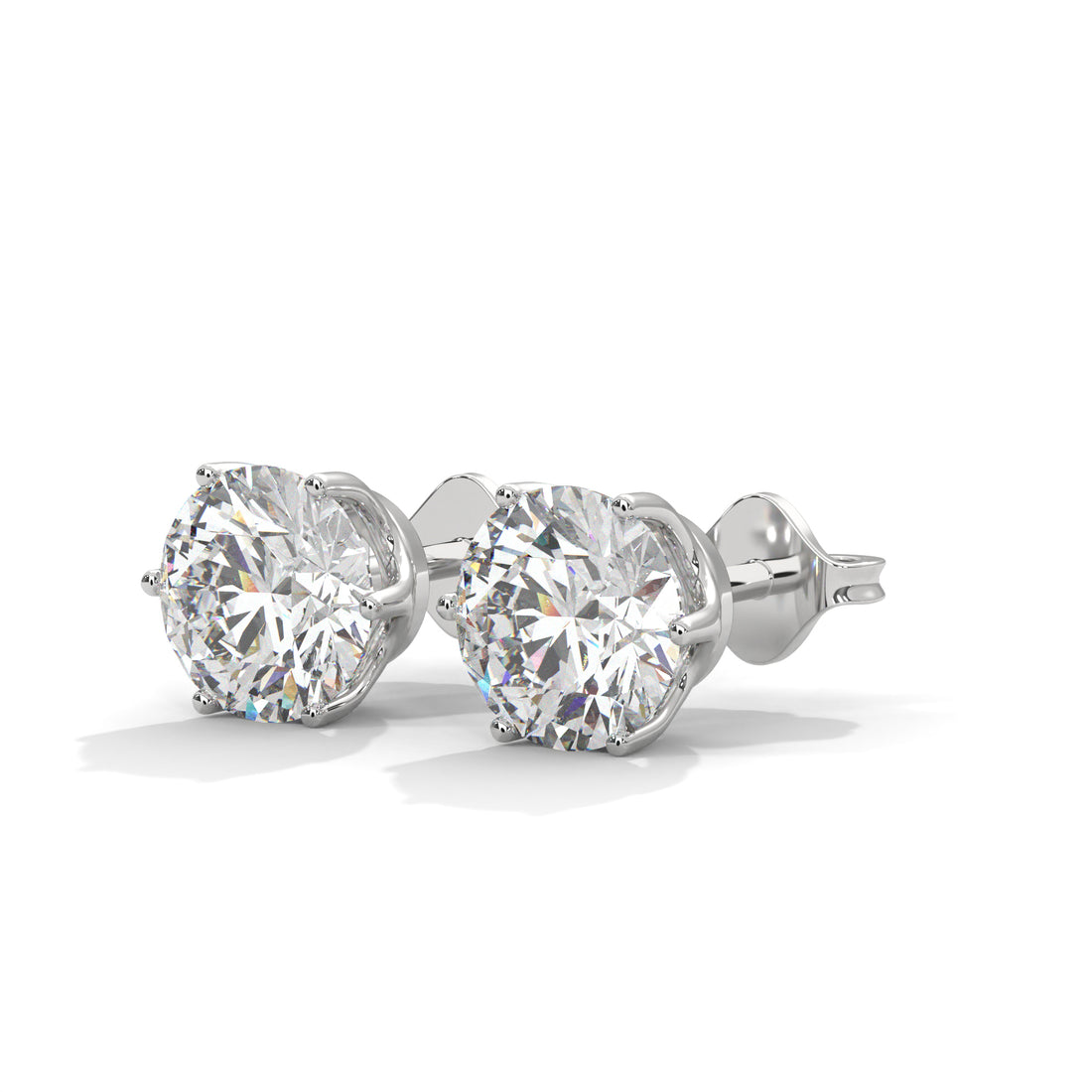Pair of diamond stud earrings on a white background