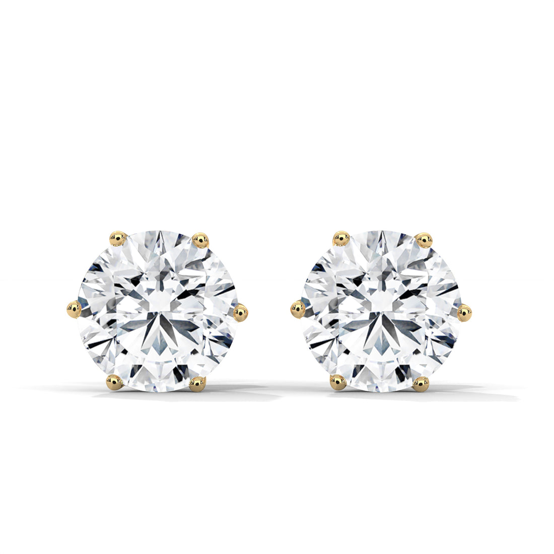 Pair of diamond stud earrings on a white background