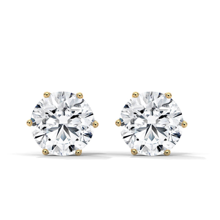 Pair of diamond stud earrings on a white background