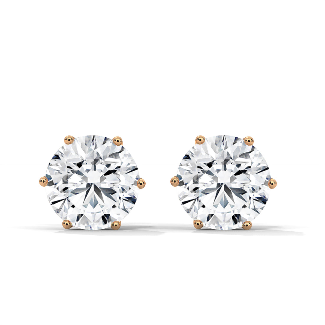 Pair of diamond stud earrings on a white background