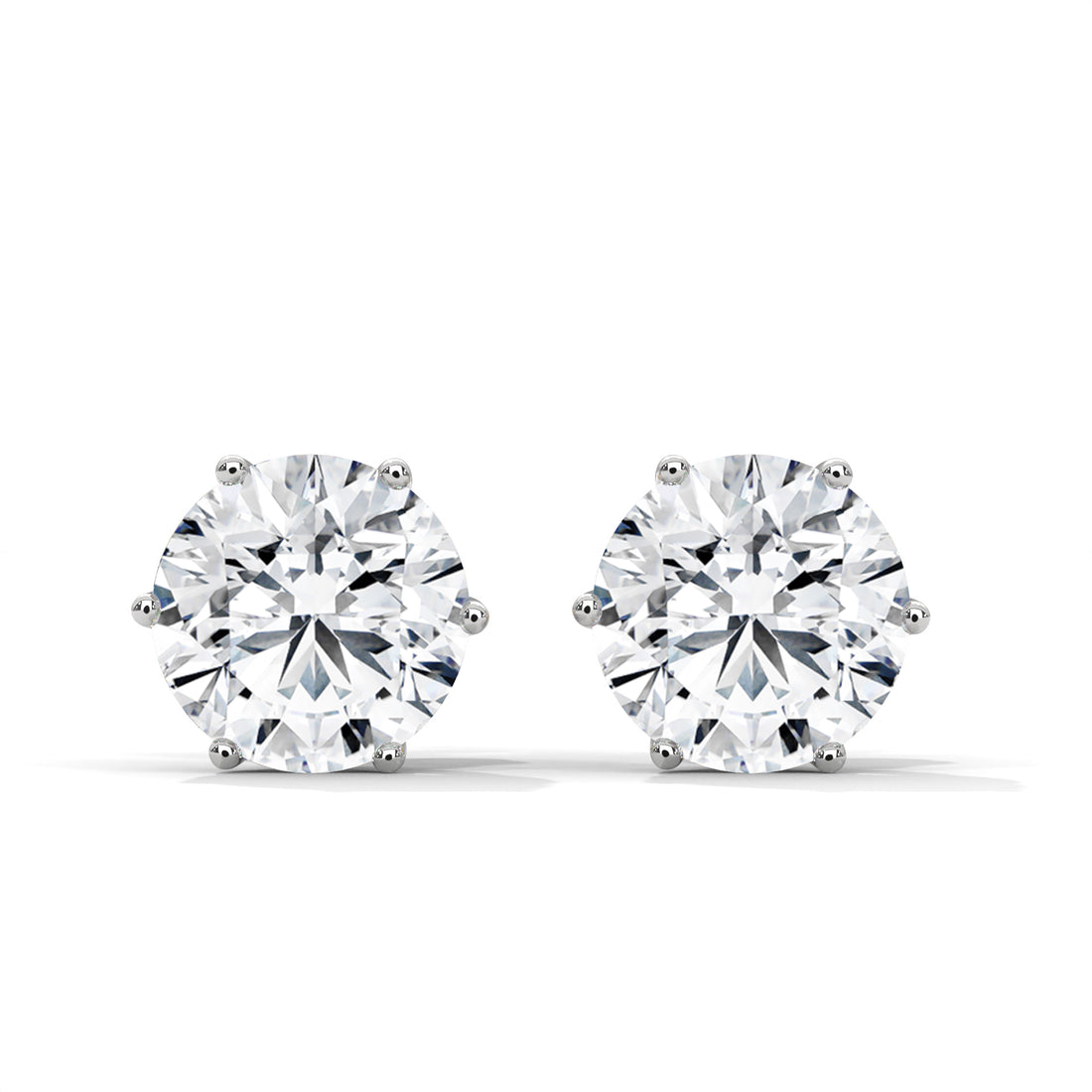 Pair of diamond stud earrings on a white background