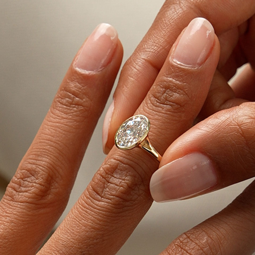 Solitaire Oval Cut Bezel Set Lab Diamond Engagement Ring