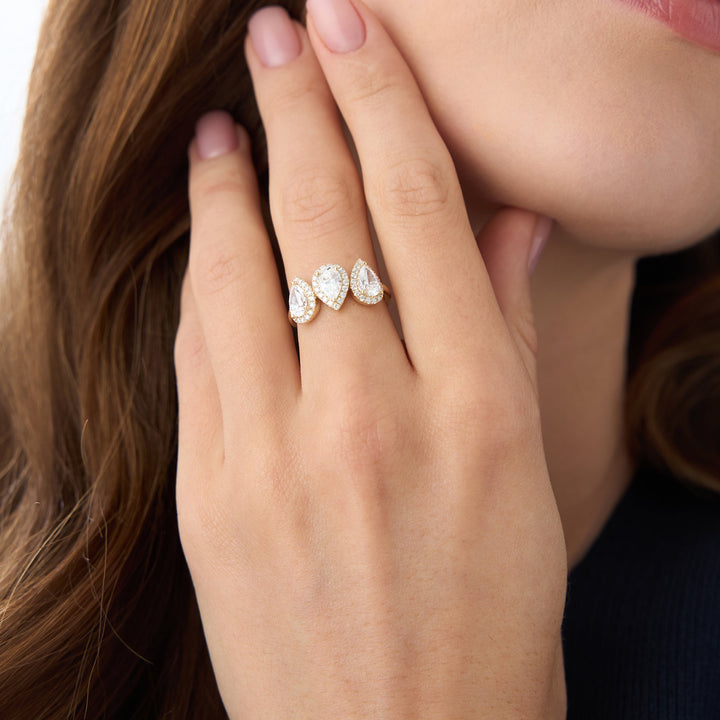 Close-up of a hand wearing a diamond ring.