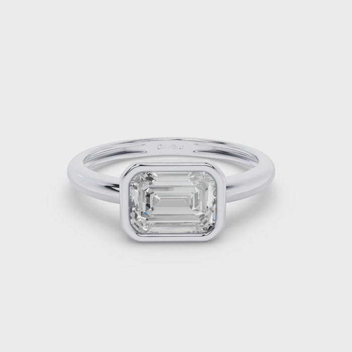 East West Emerald Cut Lab Grown Bezel Setting Engagement Ring