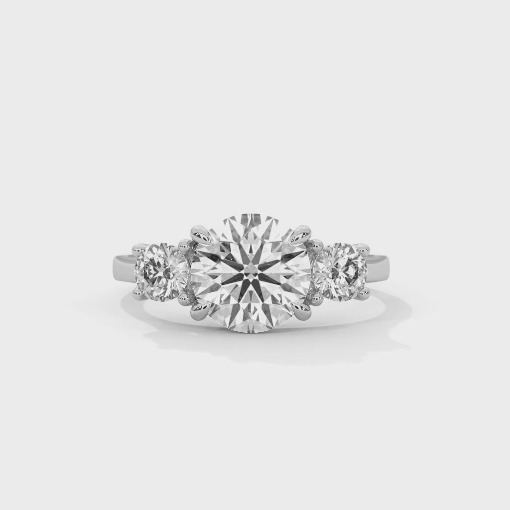 Round brilliant three stone ring